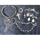 A quantity of silver jewellery including bangle, lockets, cross pendants, anklet,