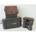 A pair of antique opera glasses and a Kodak No1 autographic folding camera,