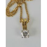 An 18ct gold and diamond pendant on fine 18ct gold chain,