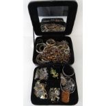 A quantity of assorted costume jewellery including pendants, horse head tie clip, bangles,