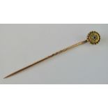 A diamond and yellow metal tie pin, cent