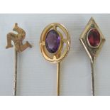 Three yellow metal tie pins, one of diam