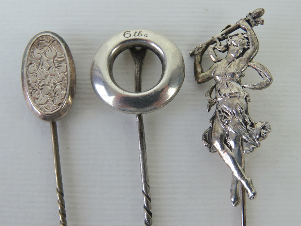 Two silver tie pins, one with engraved f