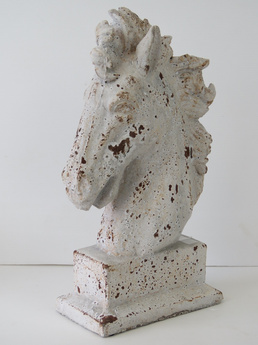 A contemporary cast stone equine figurin