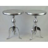 A pair of contemporary polished steel ci