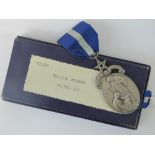 A HM silver Masonic medal presented to '