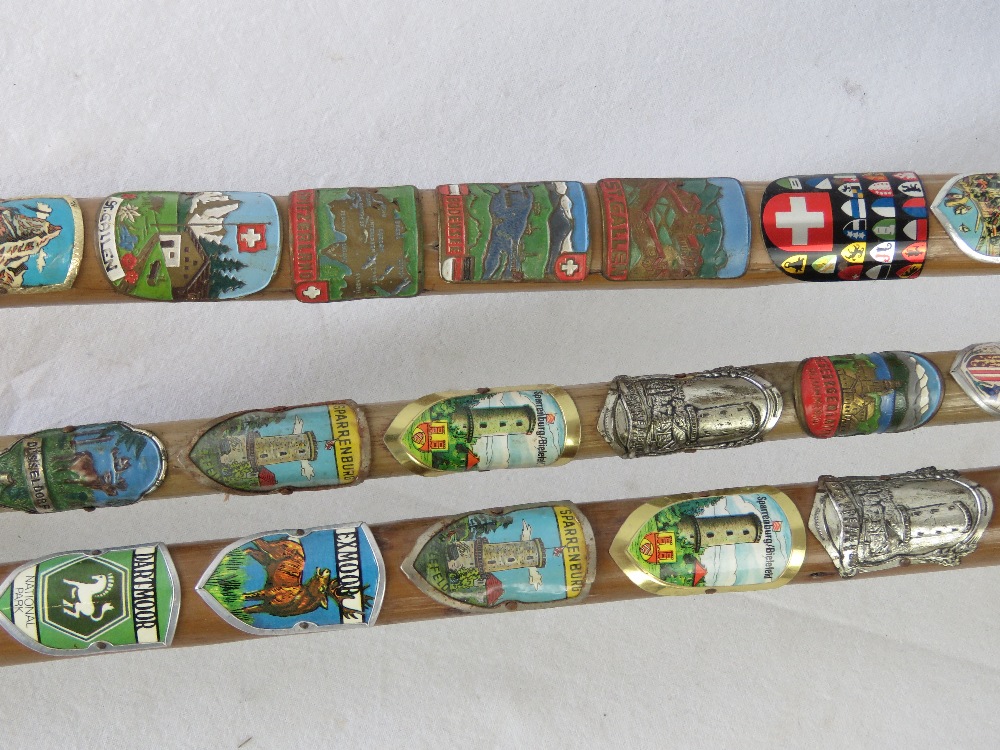 Three walking sticks each emblazoned wit - Image 2 of 2