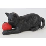 A c1930s chalkware kitten with ball of w