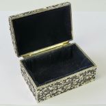 A white metal jewellery box, lid lifting