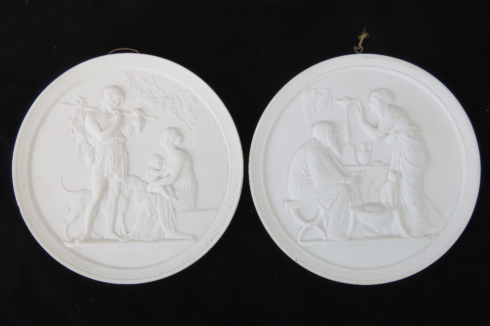 A pair of mid 19th Century bisque relief