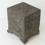 A delightful embossed metal cabinet havi