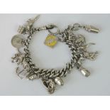 A HM silver curb link charm bracelet hav