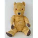 A vintage jointed mohair teddy bear c1930s, 36cm in length, a/f.