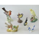 Six ceramic bird models including two Geobel models of tits, another German model of a Robin, etc,