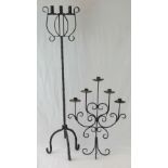 Two cast iron candelabrums; one table standing having scrollwork and five sconces, 66cm high,
