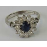 An 18ct gold, platinum, sapphire and diamond ring, central oval cut sapphire approx 0.