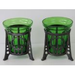 A pair of contemporary Art Nouveau WMF style pierced metal holders with green glass beaker vases, 9.