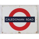 An original enamelled tin plate London Underground sign for Caledonian Road tube station, 56 x 71cm.