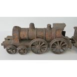 A rare late 19th century Wallwork and Company cast iron floor train comprising 4-4-0 locomotive,