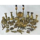 A large quantity of assorted brass items including pairs of candlesticks, chambersticks, money box,