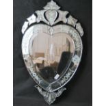 A contemporary Venetian style bevelled edge mirror in the form of a heart measuring 79cm in height,