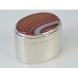 A delightful HM silver pill box having oval banded agate cabachon to the lid,