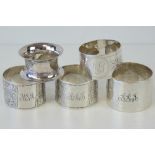 A pair of HM silver napkin rings having foliate engraving upon,