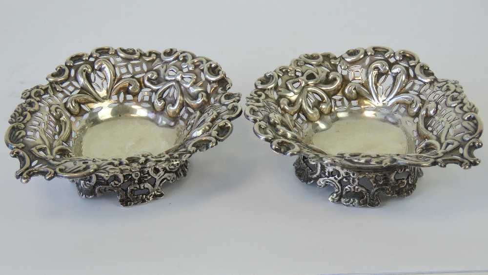 A pair of HM silver bonbon dishes in the form of hearts and having pierced decoration,