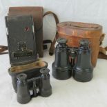 A good pair of Edwardian field glasses in a leather case,