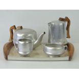 A vintage Picquot Ware Magnailium tea service comprising 'T6' teapot, 'J6' water jug,