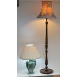 A reeded mahogany standard lamp complete with shade,