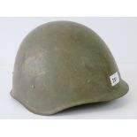 A c1950s Russian helmet with chin strap and liner.