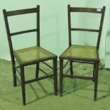 A pair of cane seated bedroom chairs c1930s.