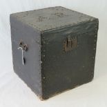 A vintage trunk having studwork throughout and twin end handles, paper lined, 43 x 40 x 40cm.