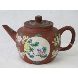 A late 19th century Chinese Yixing red earthenware teapot with infuser and lid,