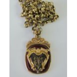 A 9ct gold and carnelian fob pendant having monogrammed cartouche upon, and hallmarked 375,