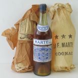 A bottle of Martell Cognac Brandy within original wrapping,