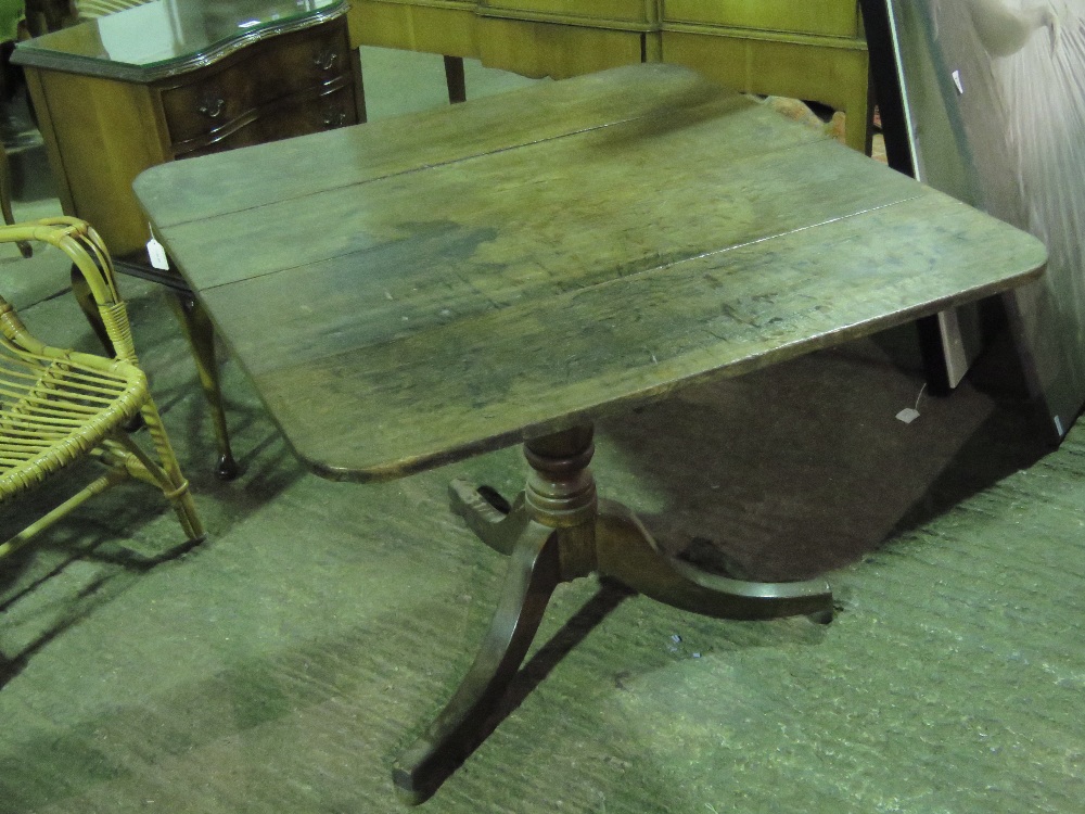A square shaped four panel tilt top table raised over three outswept feet, 92cm wide,