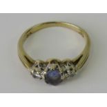 A 9ct gold diamond and amethyst ring,