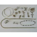 A quantity of silver and white metal jewellery including charms, Rennie Mackintosh style pendant,