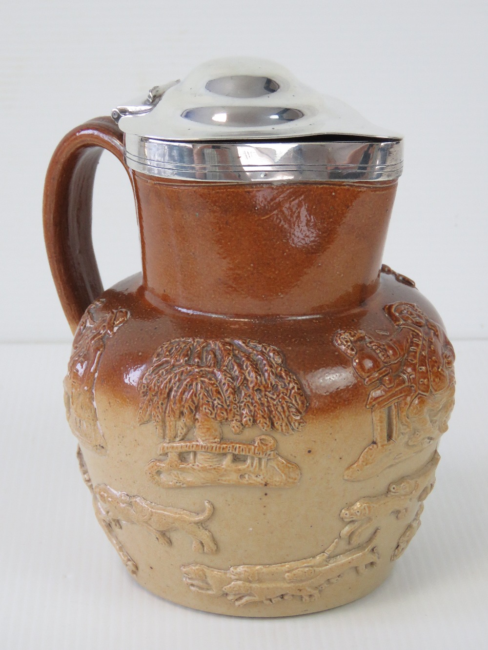 A Victorian salt glazed stoneware jug with HM silver lid, having hunting dogs, windmill, etc upon, - Image 2 of 3