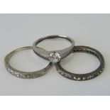 A diamond ring having ten graduated round cut diamonds all set in white metal, mark indistinct,