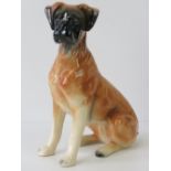 A modern pottery model of a seated boxer dog, the base impressed 'Holland 142', 27cm high.