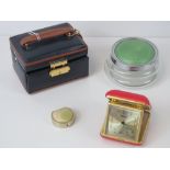 A small tan and black leather travel jewellery box,