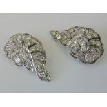 A stunning pair of diamond Art Deco 'wing' shaped earrings within original fitted presentation box.