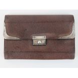 A HM silver and brown leather purse, opening to reveal tan leather lining with various compartments,
