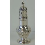 A HM silver sugar caster having gadrooned body over single foot,
