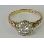 A delightful 18ct gold and diamond cluster ring, central round cut brilliant diamond approx 0.