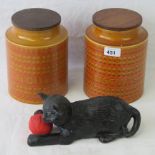 A c1930s chalkware kitten with ball of wool figurine having glass eyes and in the style of Louis