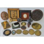 A quantity of assorted plaques and portraits including; plaster relief portraits, brass portraits,